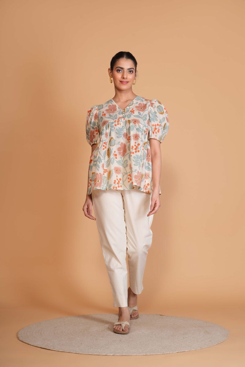 side profile of Off White Floral Alia Cut Top featuring shoulder yoke for office and workwear, women's tunic
