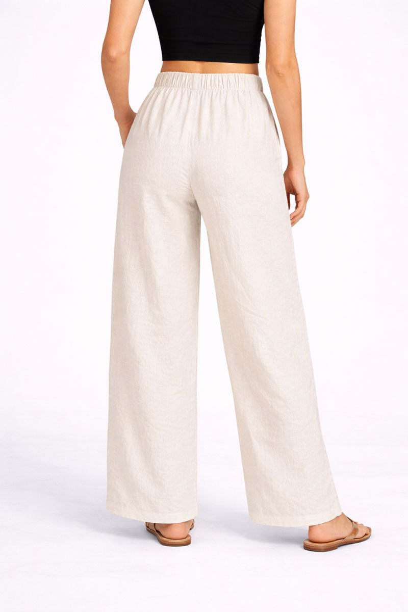 side profile of Off White Wide Leg Linen Pant in linen in a wide fit, women's wide-leg pants