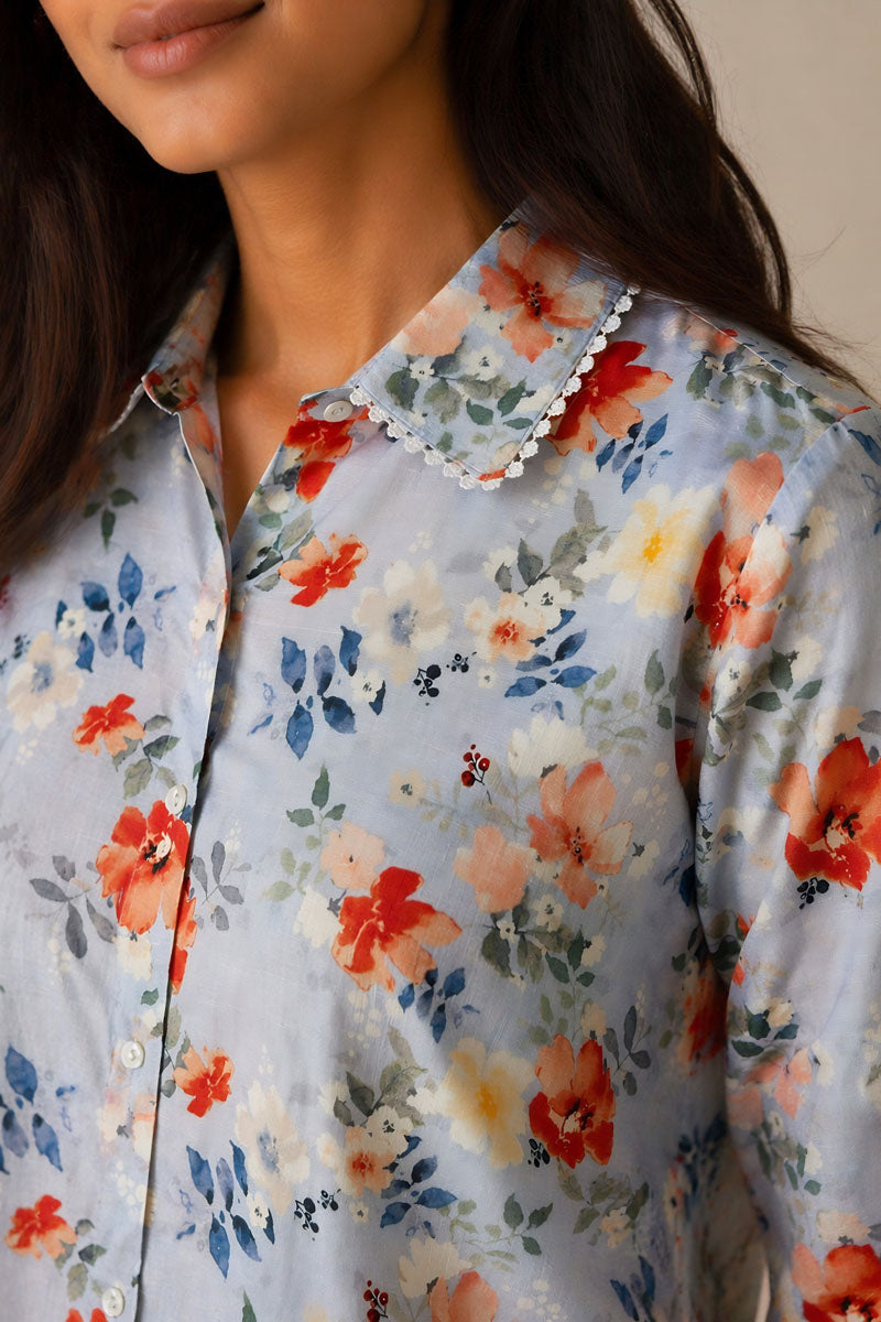 side profile of Pastel Blue Floral Shirt in a regular fit featuring sleeve cuffs, women's shirt